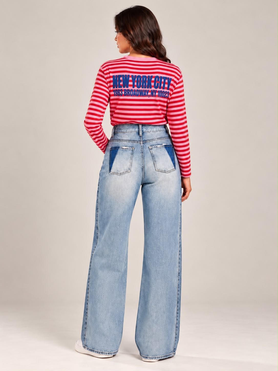 Wide-leg jeans featuring front distressing and distinctive back pockets.