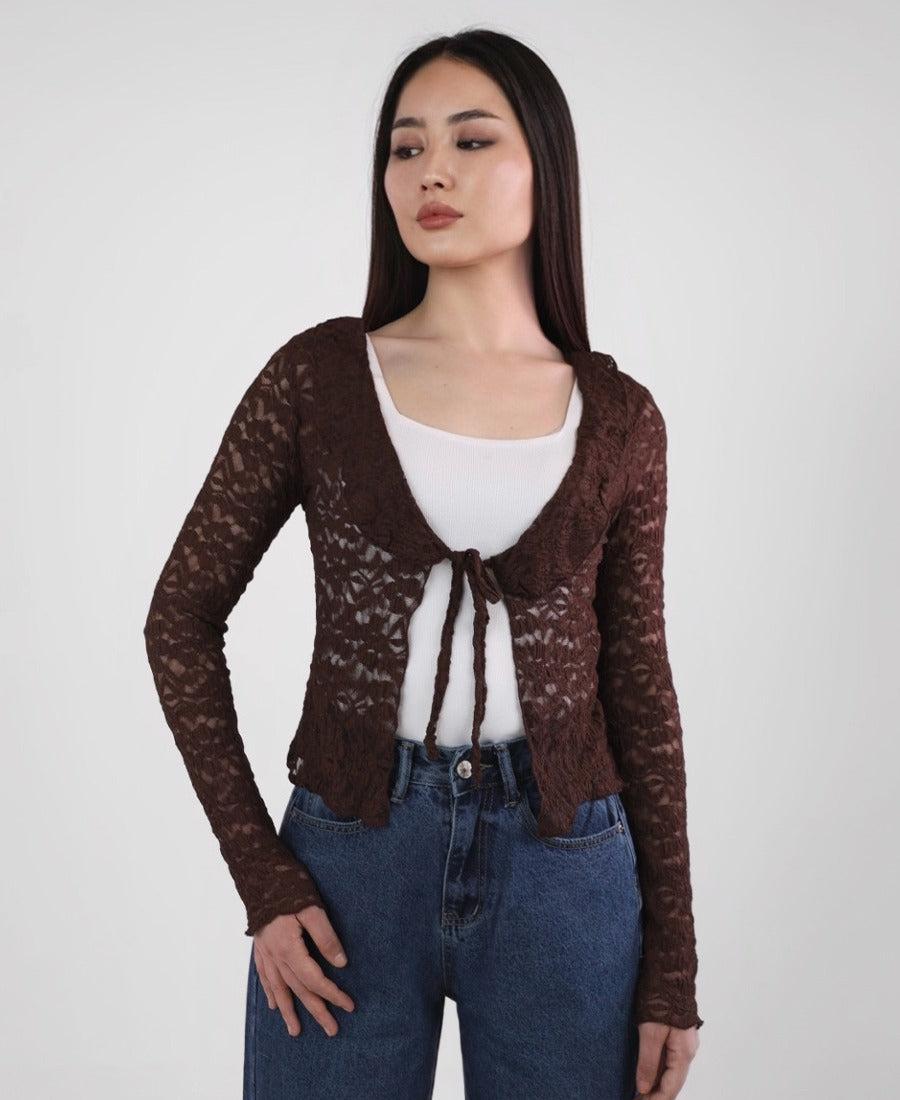 Lace cardigan with ruffles at the chest and tied in the middle